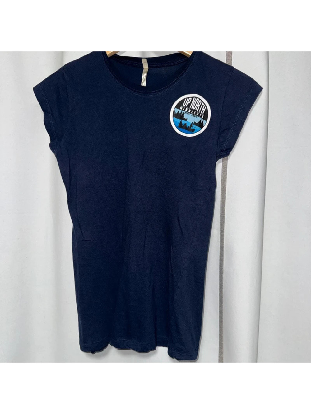 navy short-sleeve t-shirt features a circular "Up North Minnesota" graphic patch